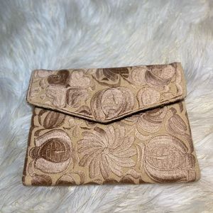 Tan floral printed clutch